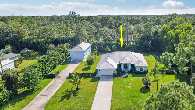 a view of yard with swimming pool and green space