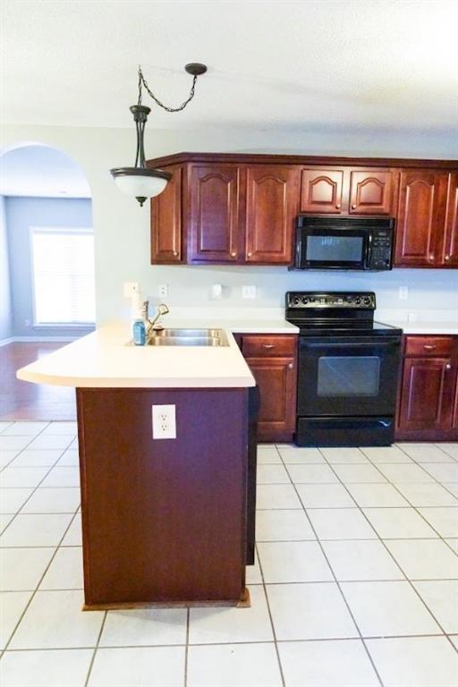 28 Papershell Drive Fort Valley, GA 31030 - Photo 16 of 64 a kitchen with stainless steel appliances granite countertop a stove a sink and a microwave