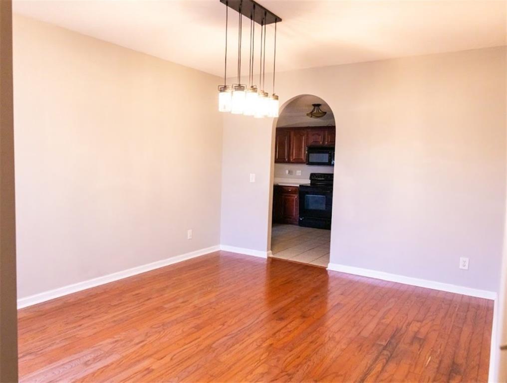 28 Papershell Drive Fort Valley, GA 31030 - Photo 20 of 64 a view of a hallway with wooden floor and a chandelier