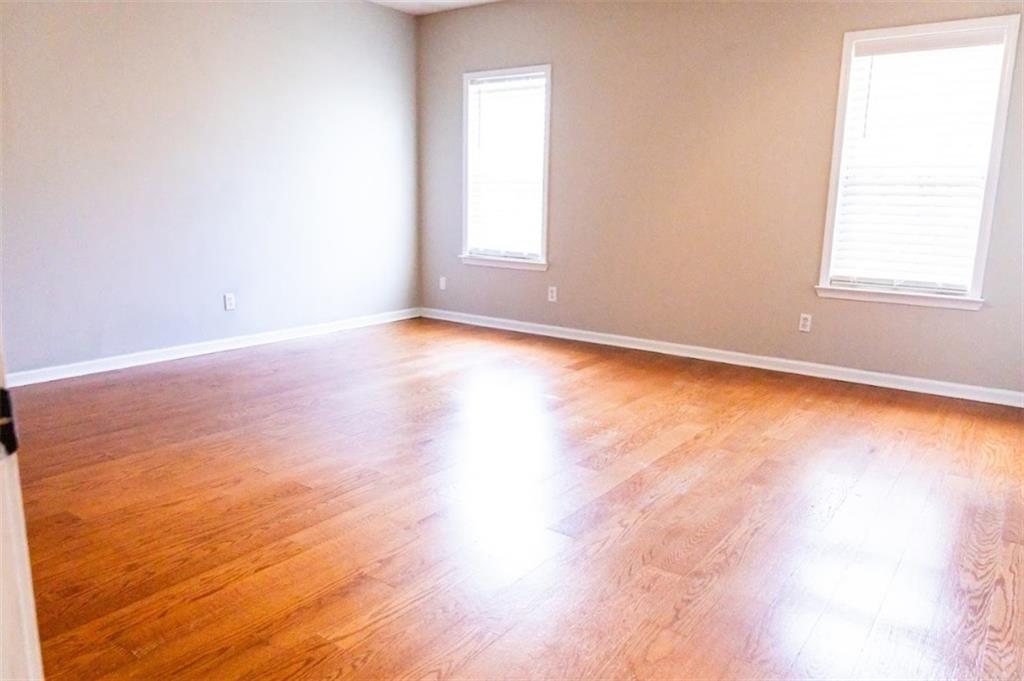 28 Papershell Drive Fort Valley, GA 31030 - Photo 47 of 64 an empty room with wooden floor and windows