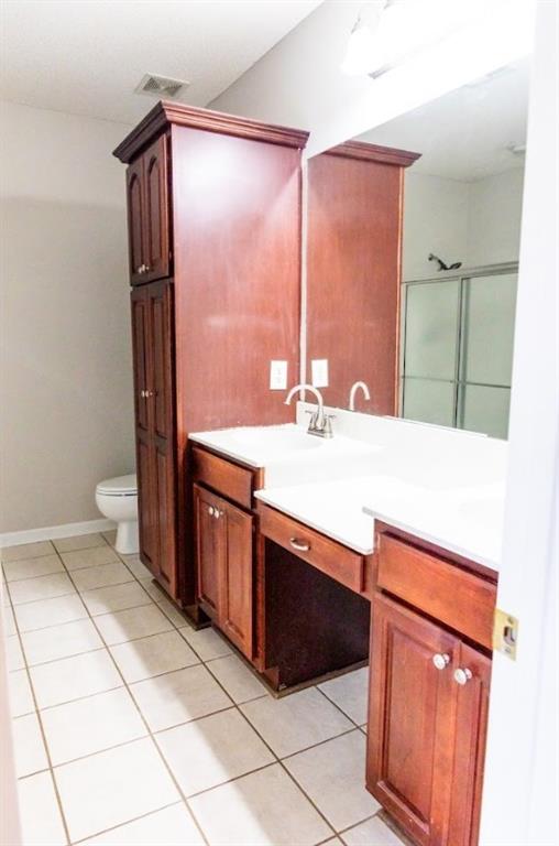 28 Papershell Drive Fort Valley, GA 31030 - Photo 54 of 64 a bathroom with a sink a toilet and a mirror