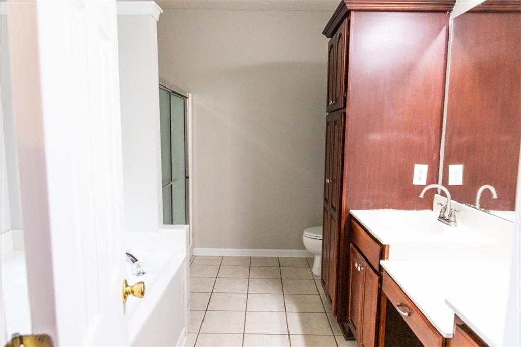 28 Papershell Drive Fort Valley, GA 31030 - Photo 55 of 64 a bathroom with a sink a toilet and mirror