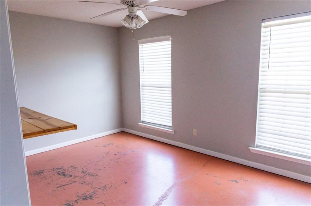 28 Papershell Drive Fort Valley, GA 31030 - Photo 9 of 64 an empty room with a window and a fan