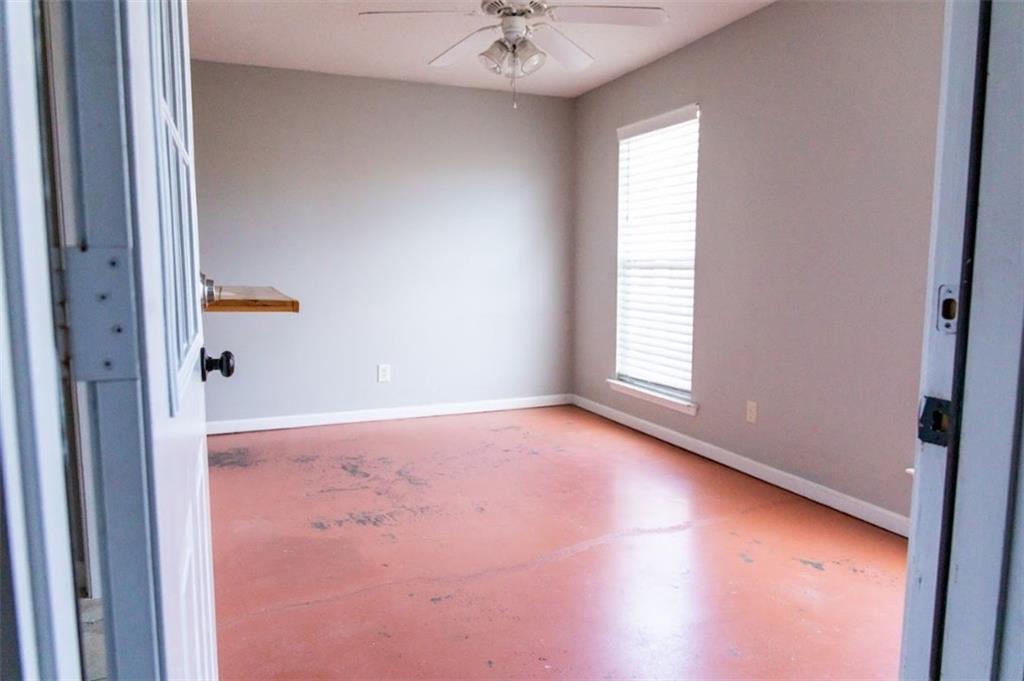 28 Papershell Drive Fort Valley, GA 31030 - Photo 10 of 64 an empty room with a window and a ceiling fan