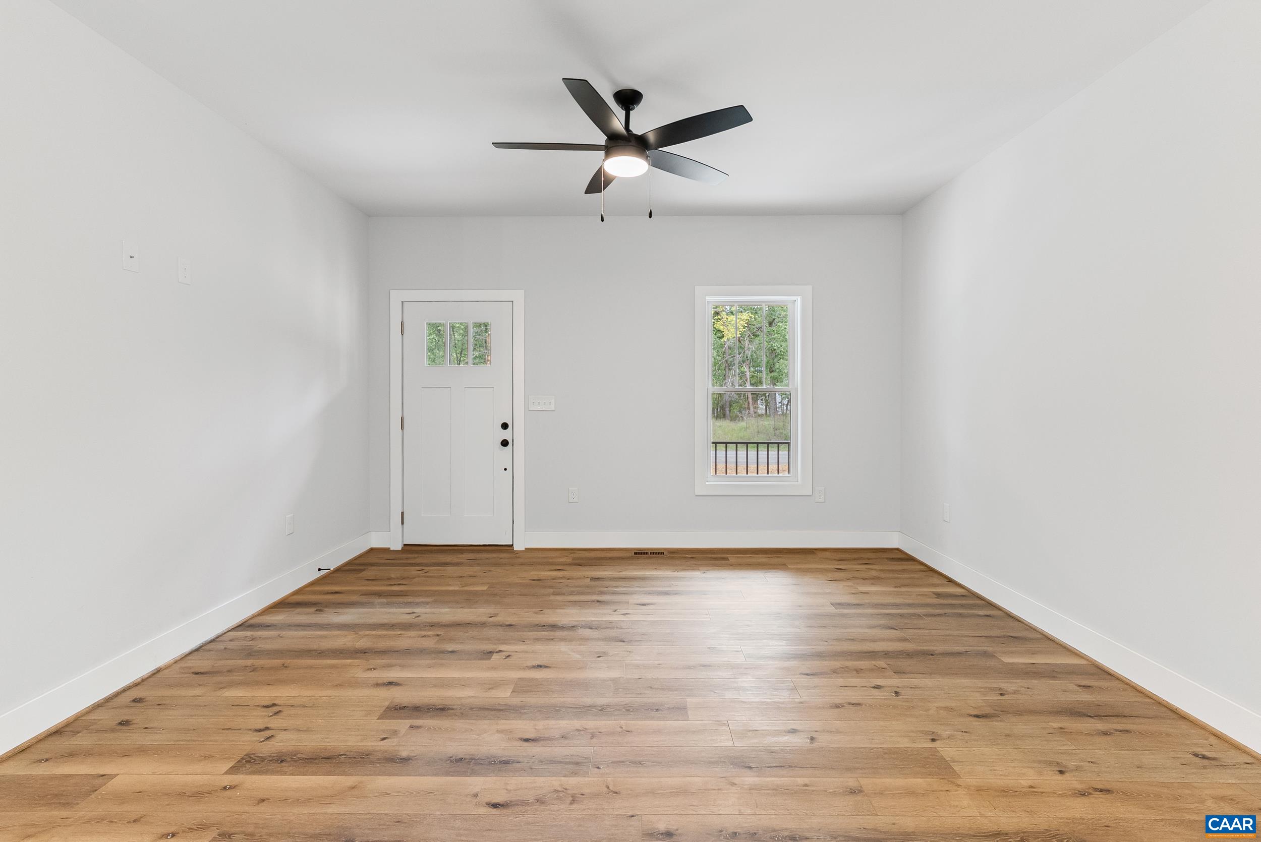 594 Community Road Dillwyn, VA 23936 - Photo 12 of 48 wooden floor in an empty room with a window