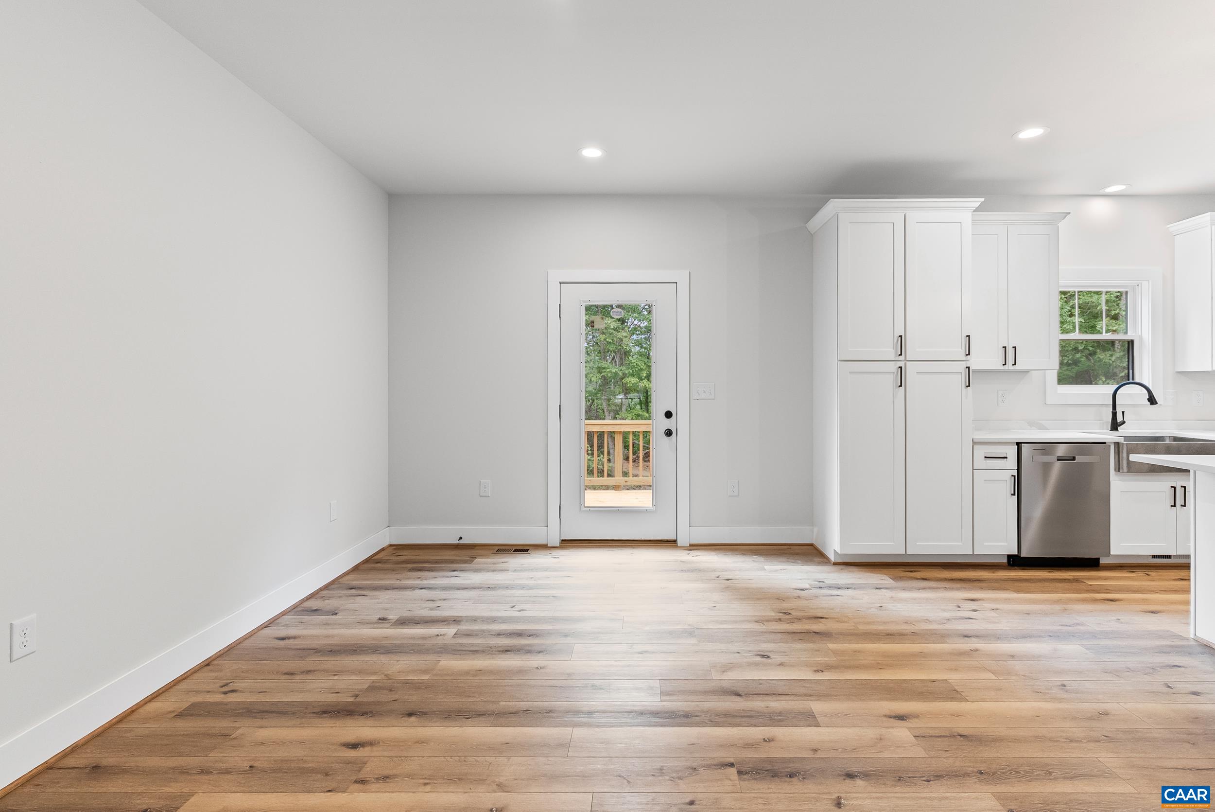 594 Community Road Dillwyn, VA 23936 - Photo 17 of 48 a view of a kitchen with wooden floor and a kitchen