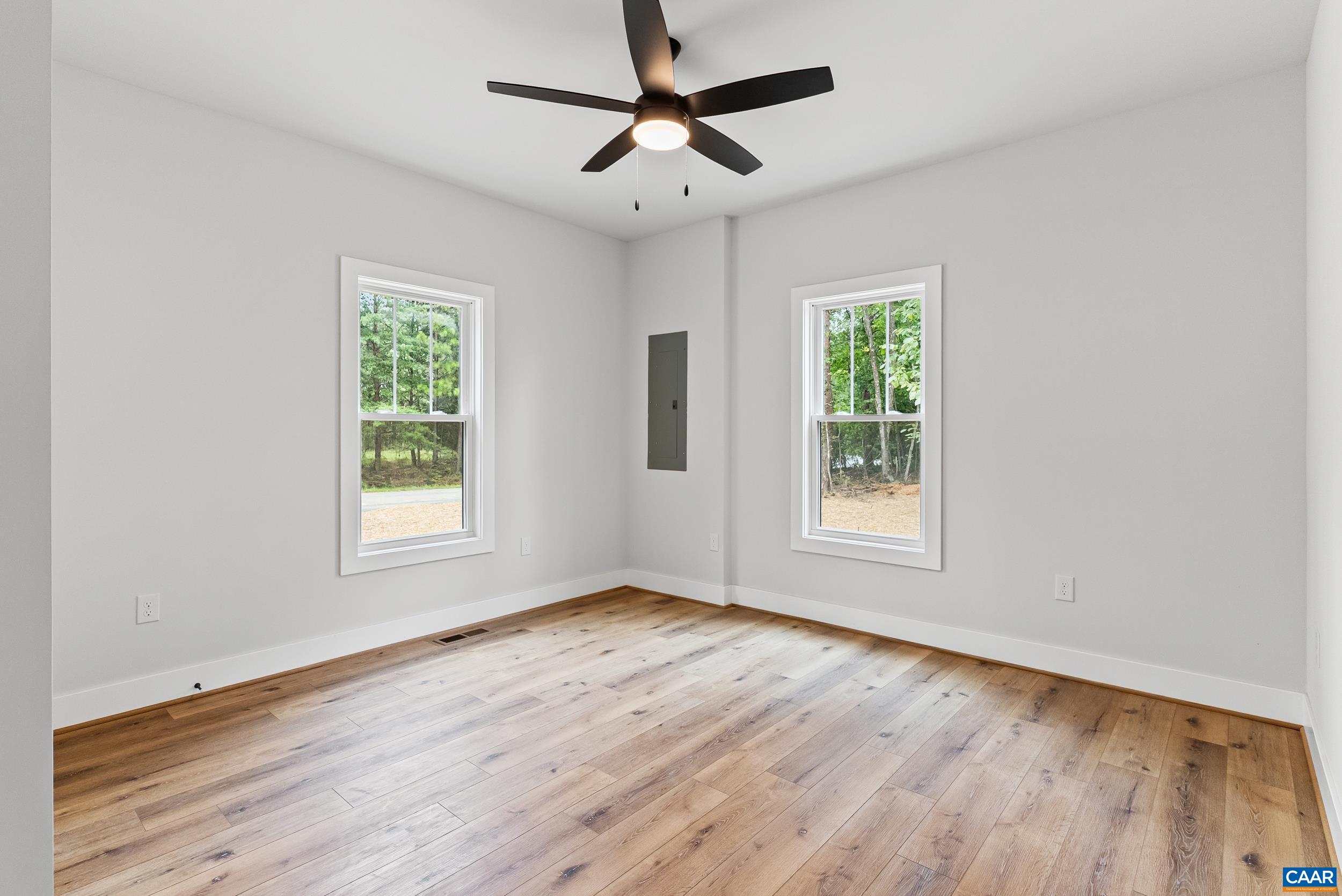 594 Community Road Dillwyn, VA 23936 - Photo 27 of 48 a view of an empty room with wooden floor and a window