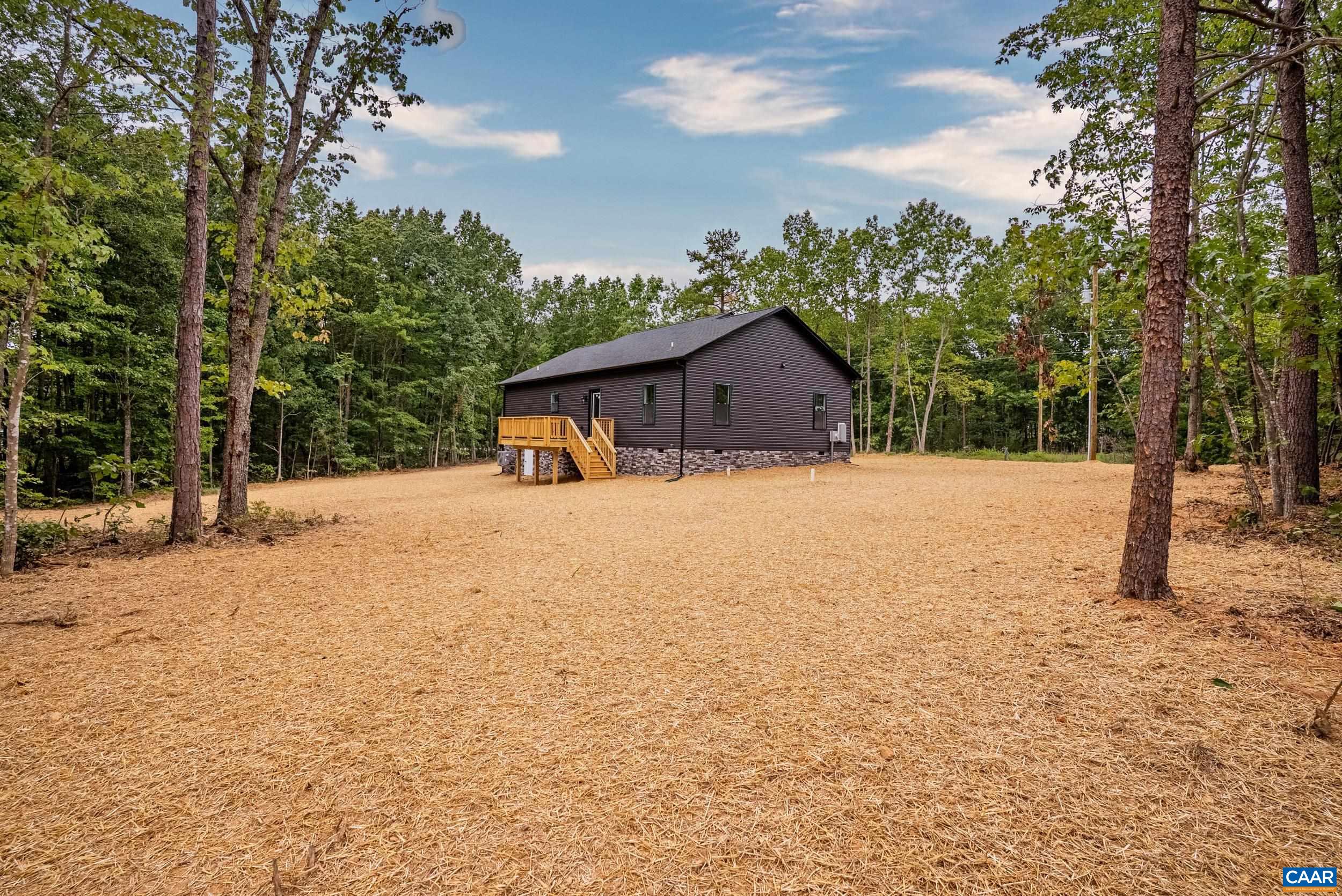 594 Community Road Dillwyn, VA 23936 - Photo 42 of 48 a large house with a large tree in front of it