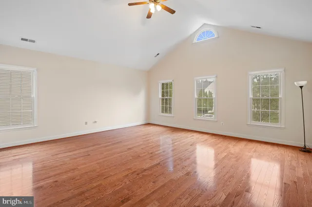 a bathroom with a double vanity sink a mirror and a shower