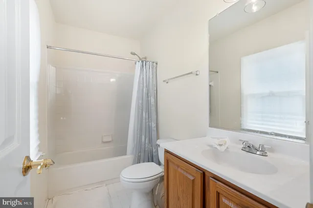 a front view of a house with a garden and patio