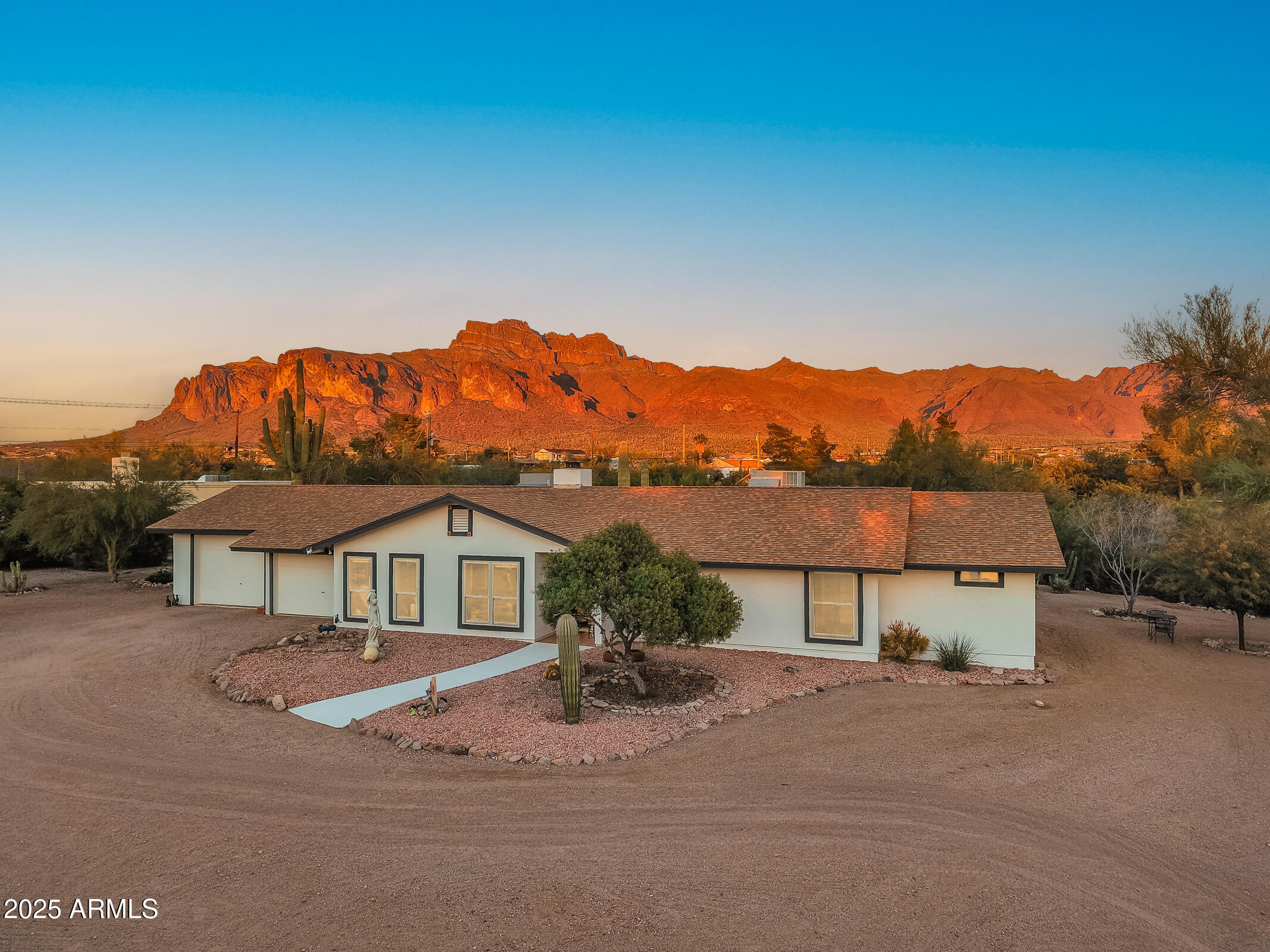 a view of a house with a mountain in the background