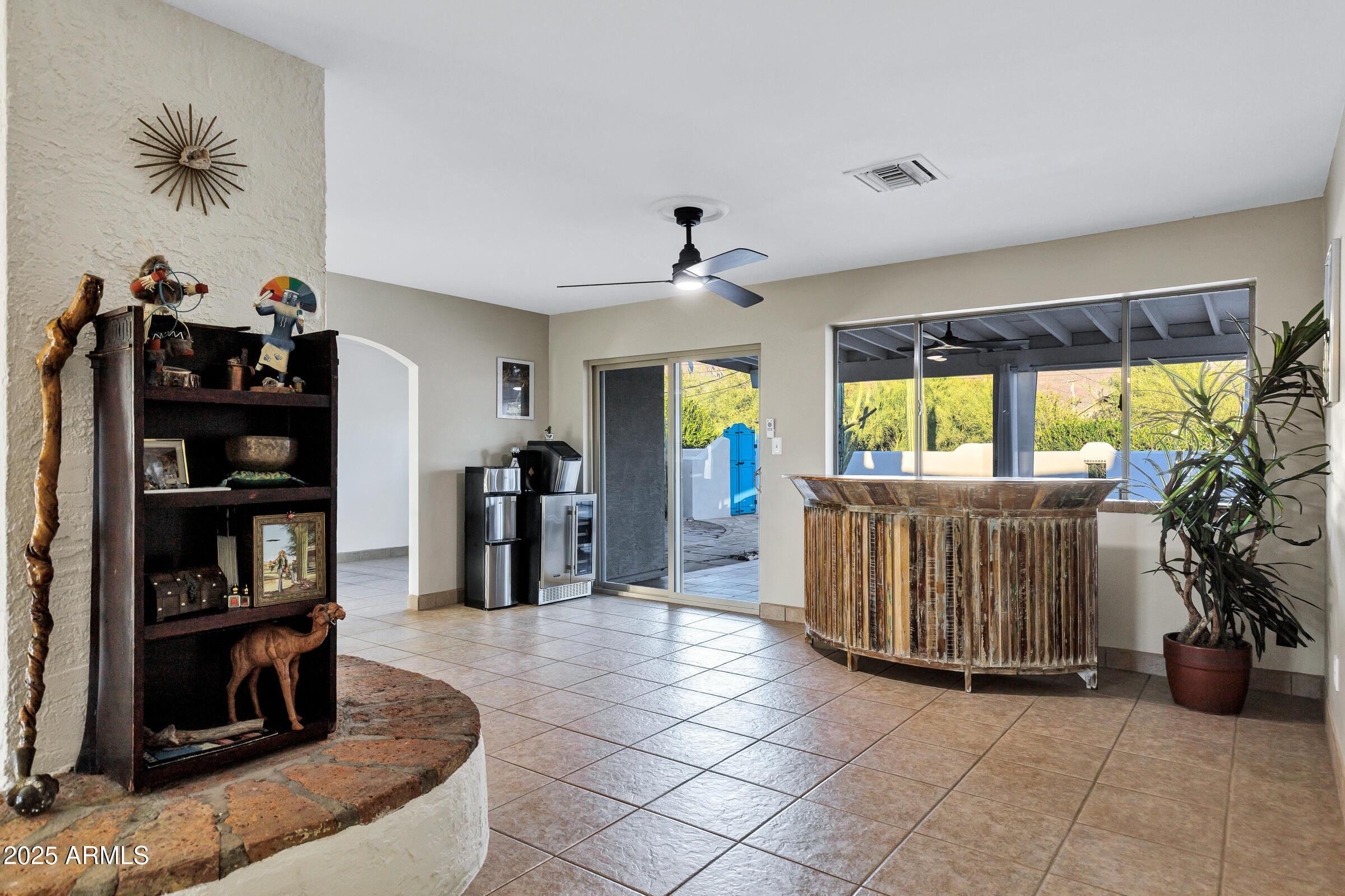 1291 South Red Rock Court Apache Junction, AZ 85119 - Photo 12 of 48 a living room with furniture and a book shelf