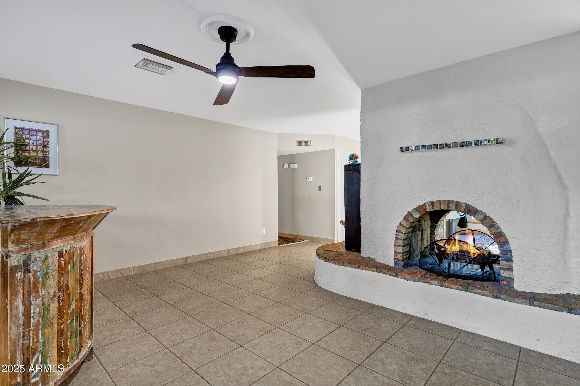 1291 South Red Rock Court Apache Junction, AZ 85119 - Photo 14 of 48 a view of a livingroom with a car parked in it