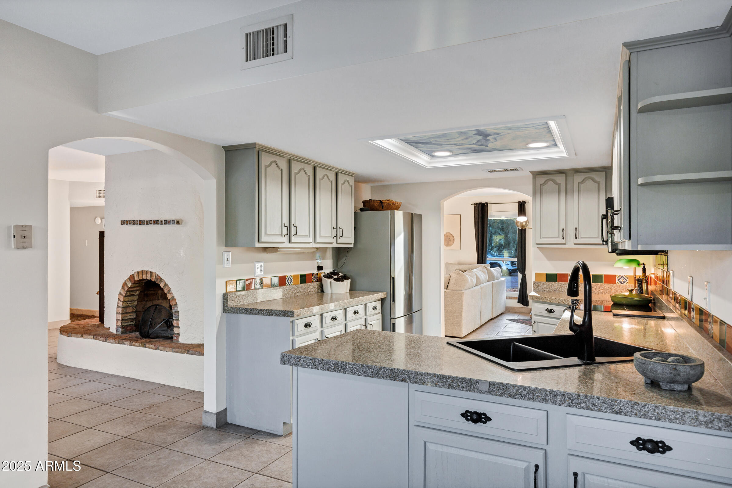1291 South Red Rock Court Apache Junction, AZ 85119 - Photo 18 of 48 a kitchen with granite countertop a sink a stove and cabinets