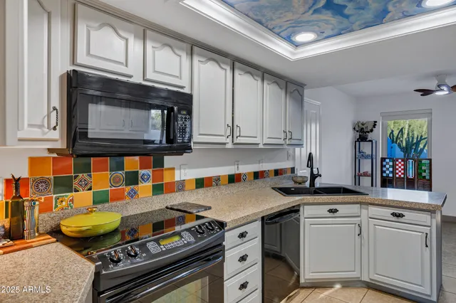 a kitchen with stainless steel appliances granite countertop a stove and a microwave