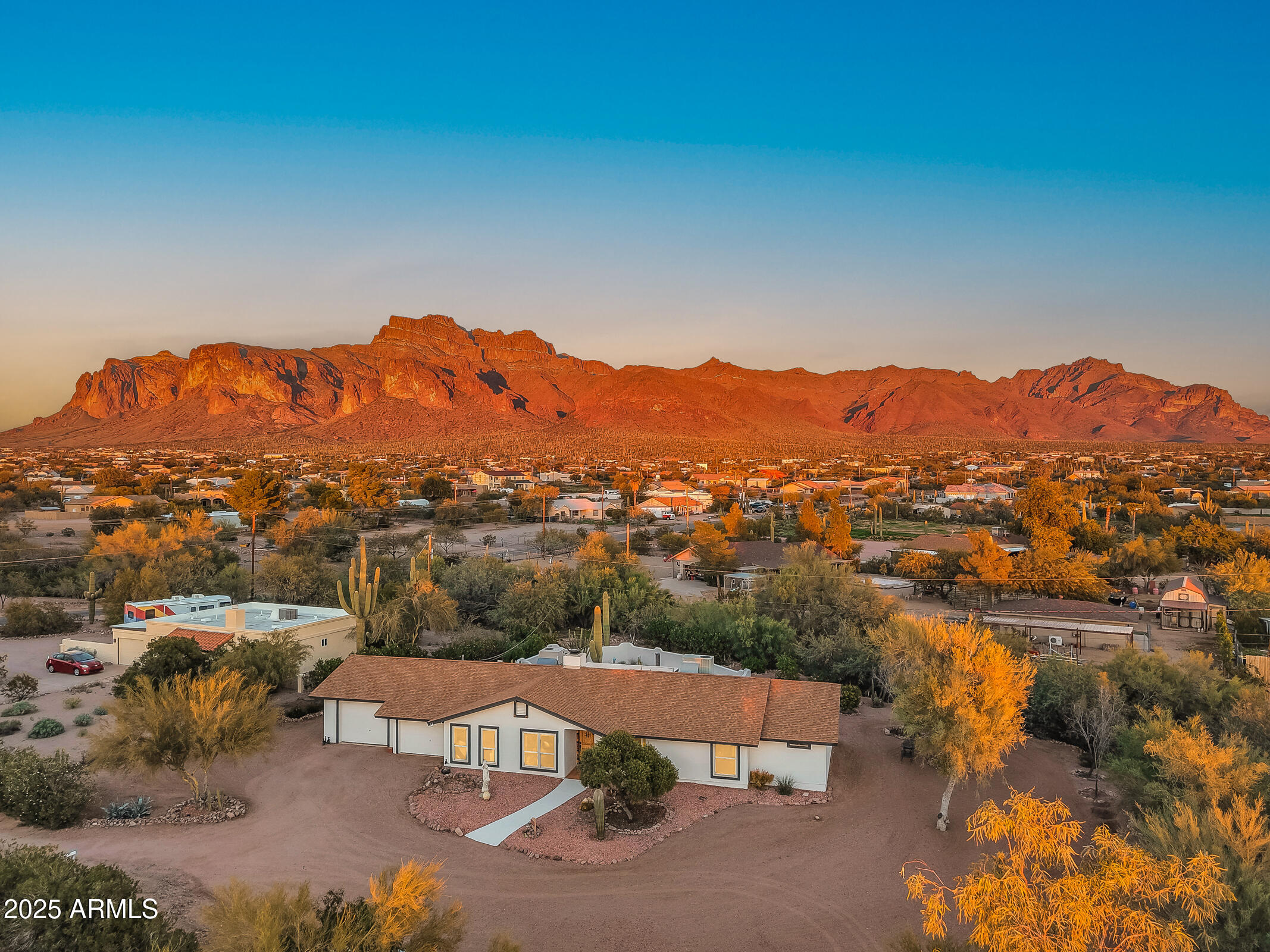 1291 South Red Rock Court Apache Junction, AZ 85119 - Photo 2 of 48 an aerial view of residential house with an outdoor space and seating