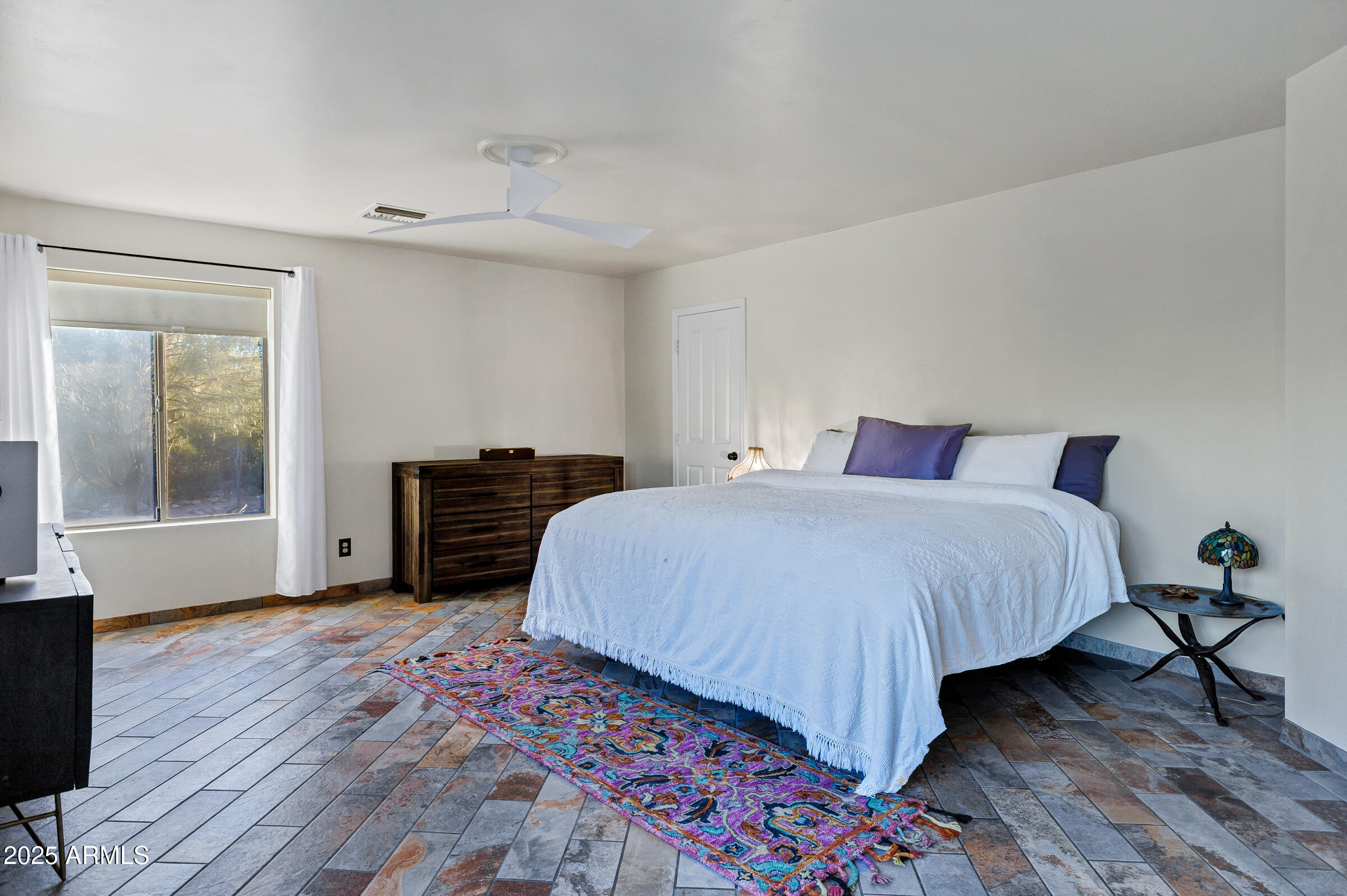1291 South Red Rock Court Apache Junction, AZ 85119 - Photo 23 of 48 a bedroom with a bed and wooden floor