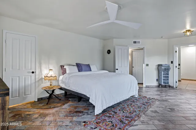 a bedroom with a bed and a table