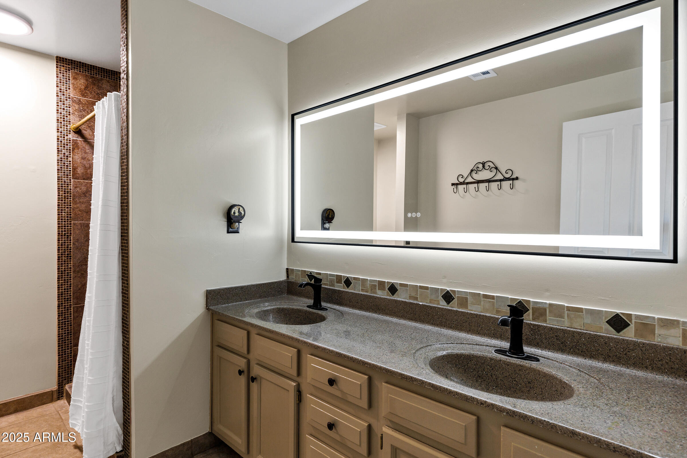 1291 South Red Rock Court Apache Junction, AZ 85119 - Photo 26 of 48 a bathroom with a sink and a mirror