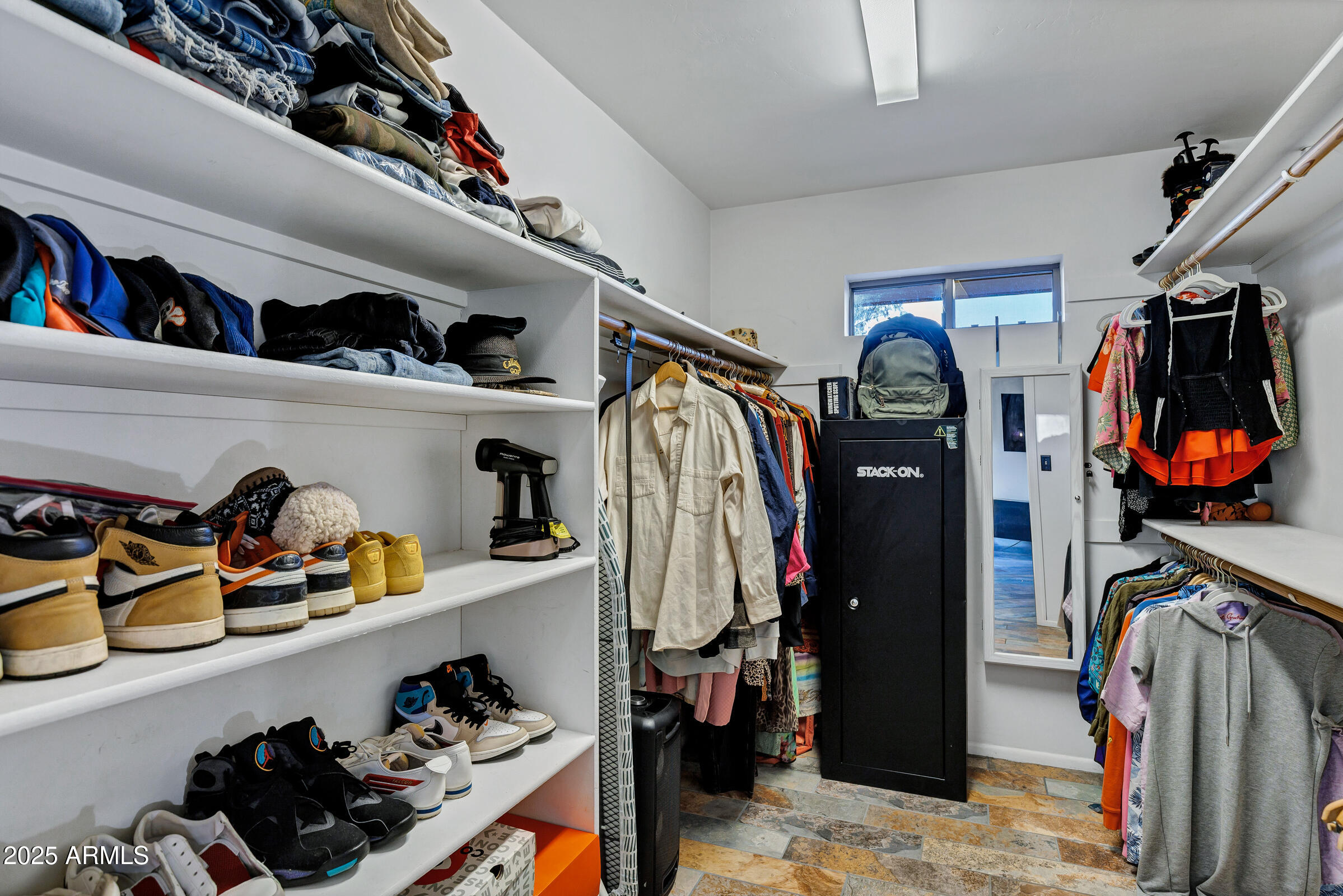 1291 South Red Rock Court Apache Junction, AZ 85119 - Photo 28 of 48 a view of walk in closet with clothes and shoes