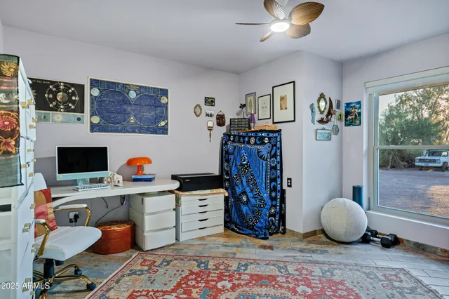 a workspace with furniture and window