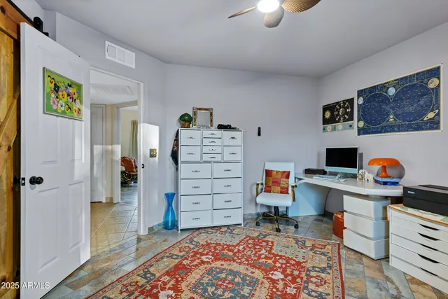 a workspace with furniture and window