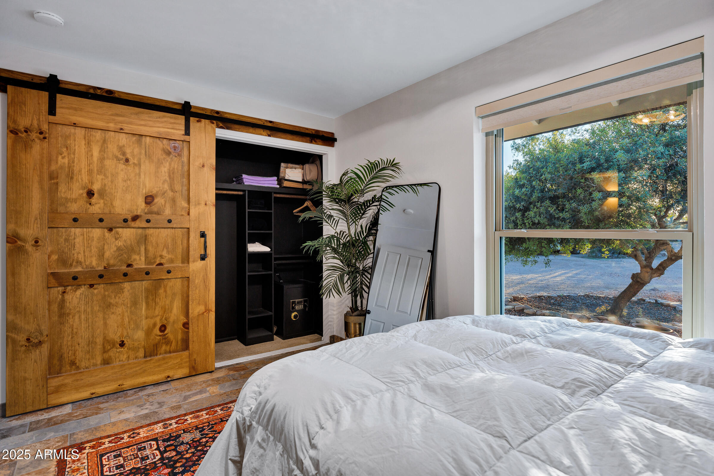 1291 South Red Rock Court Apache Junction, AZ 85119 - Photo 34 of 48 a bedroom with a bed and a mirror