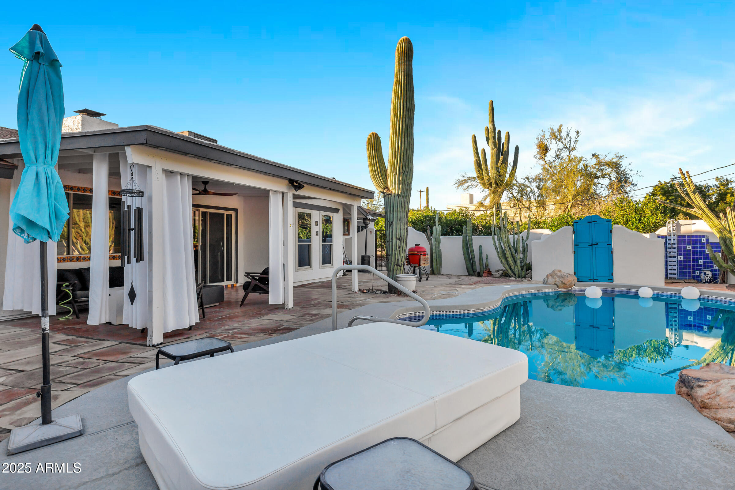1291 South Red Rock Court Apache Junction, AZ 85119 - Photo 35 of 48 a view of a patio with couches table and chairs and potted plants