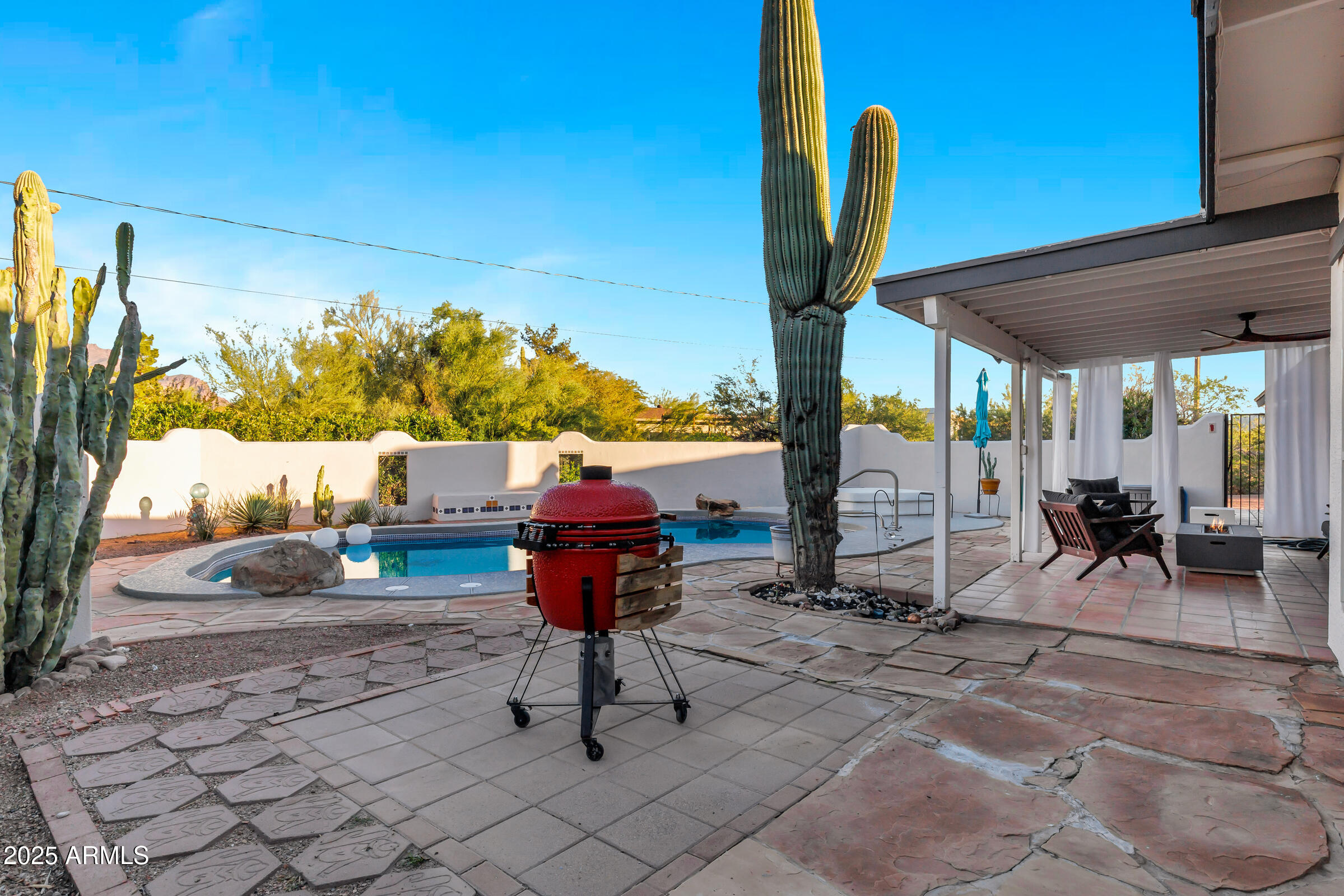 1291 South Red Rock Court Apache Junction, AZ 85119 - Photo 37 of 48 a view of living room with patio furniture and potted plants