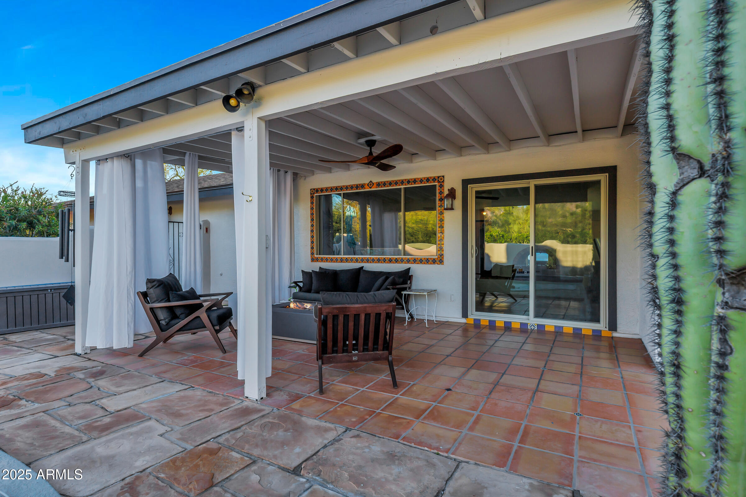 1291 South Red Rock Court Apache Junction, AZ 85119 - Photo 38 of 48 a view of a patio with table and chairs next to a yard