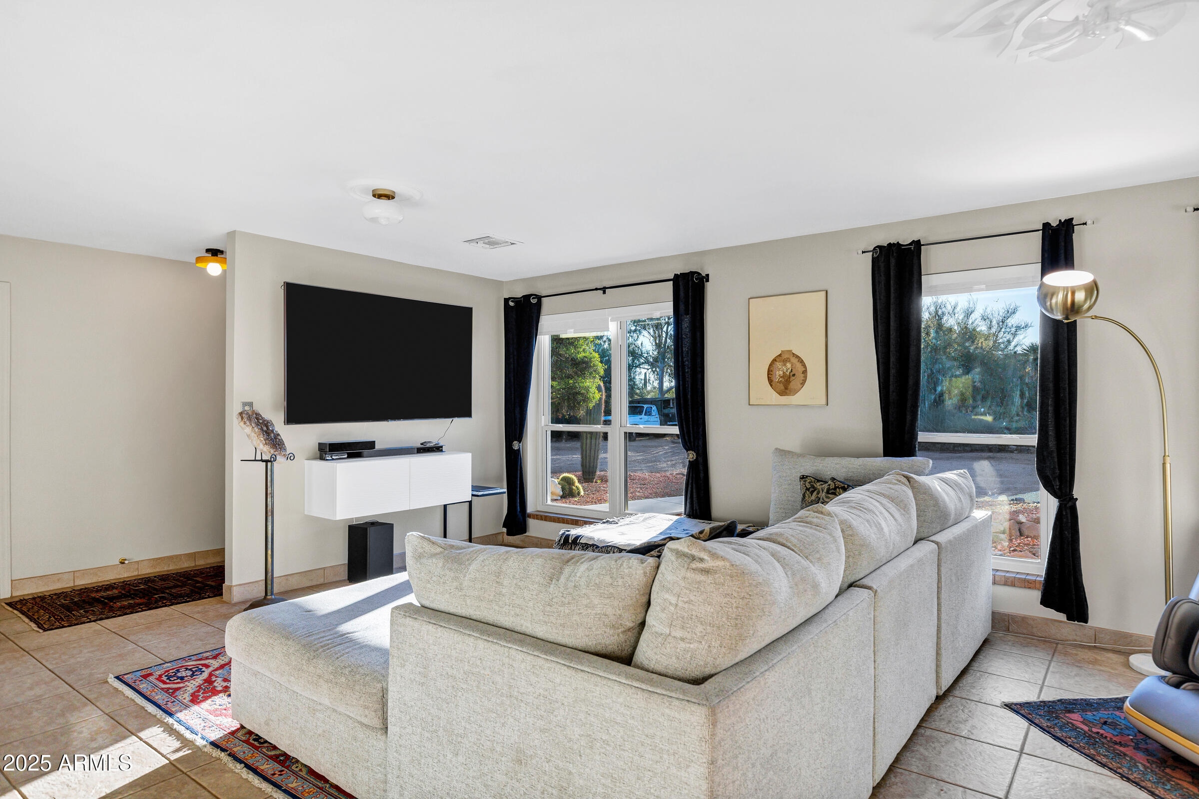 1291 South Red Rock Court Apache Junction, AZ 85119 - Photo 9 of 48 a living room with fireplace furniture and a flat screen tv