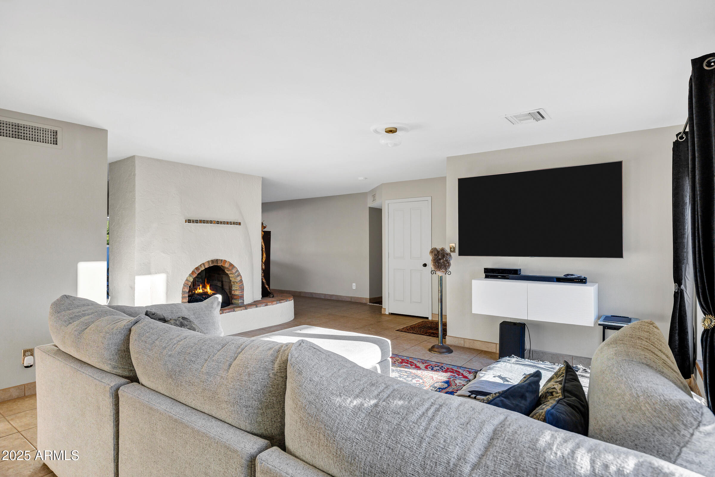 1291 South Red Rock Court Apache Junction, AZ 85119 - Photo 10 of 48 a living room with furniture and a flat screen tv