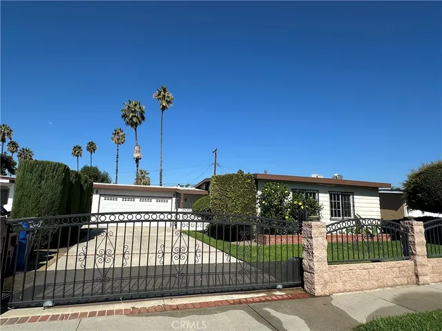 a view of a house with a small yard and plants