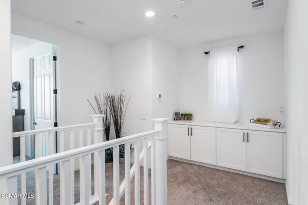 a view of cabinets and window