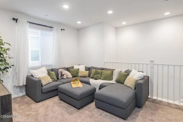 a living room with furniture and window