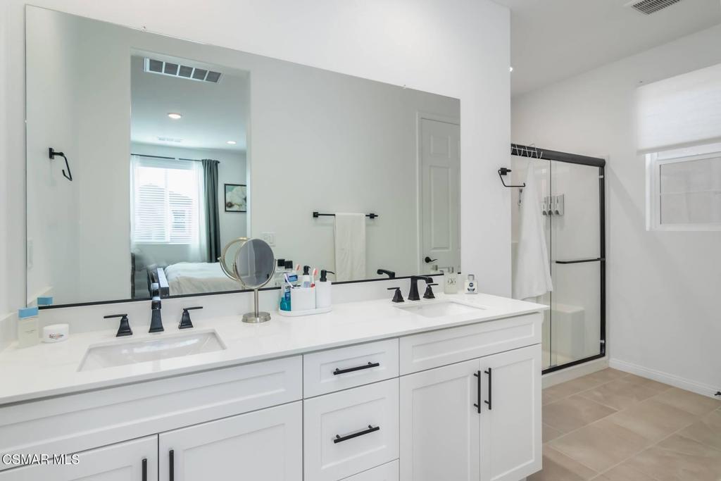 1855 Malalenca Road Santa Paula, CA 93060 - Photo 16 of 39 a bathroom with double sink and a mirror