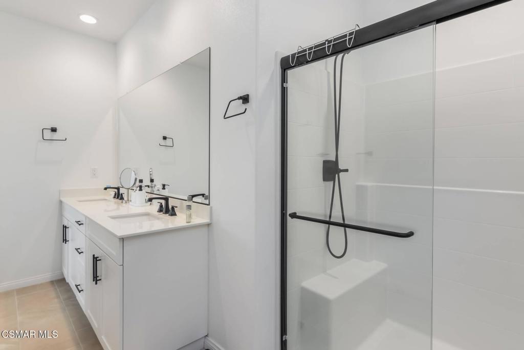1855 Malalenca Road Santa Paula, CA 93060 - Photo 17 of 39 a bathroom with a shower sink and mirror