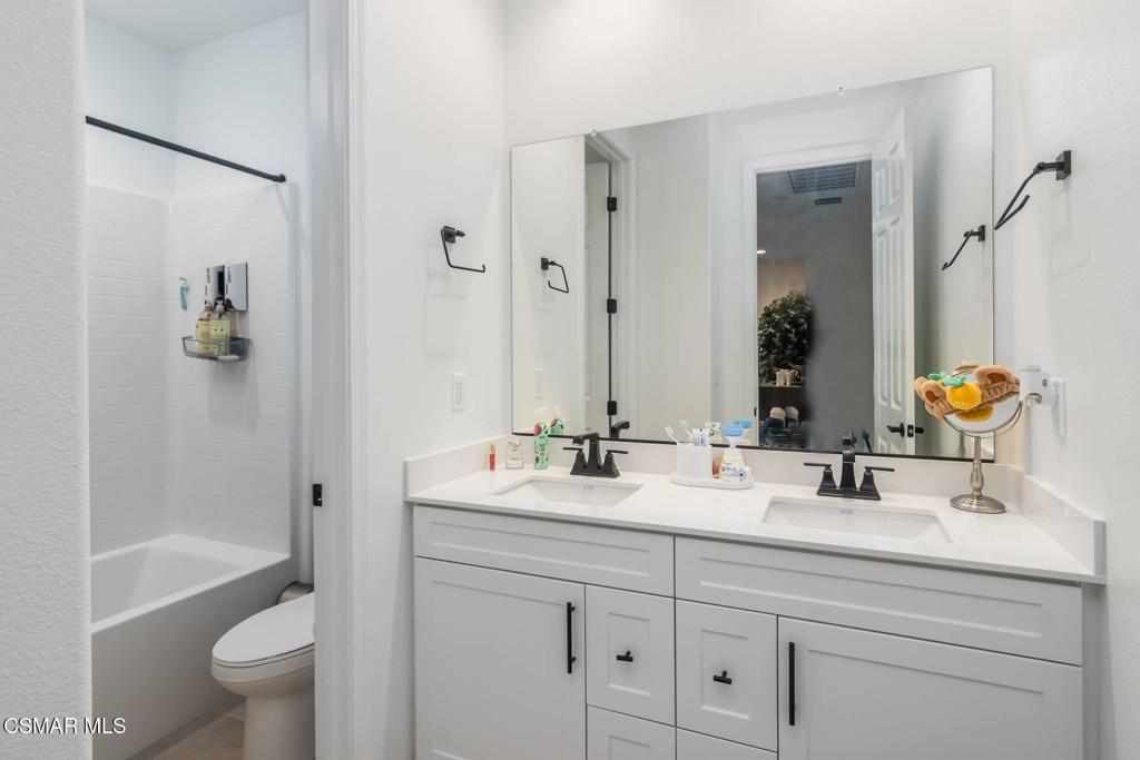 1855 Malalenca Road Santa Paula, CA 93060 - Photo 19 of 39 a bathroom with a double vanity sink toilet and shower