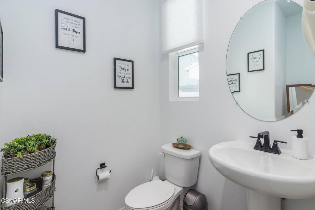 1855 Malalenca Road Santa Paula, CA 93060 - Photo 22 of 39 a bathroom with a toilet sink and mirror