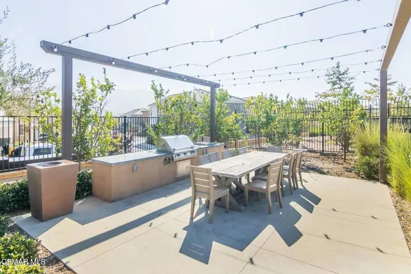 a outdoor dining space with furniture and garden view