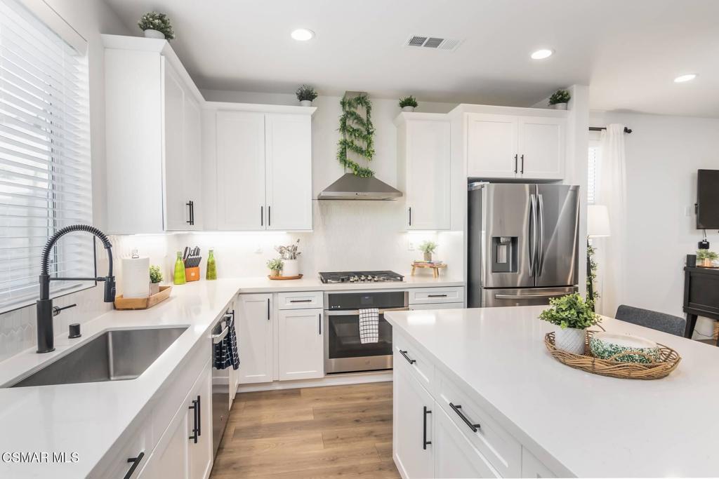 1855 Malalenca Road Santa Paula, CA 93060 - Photo 7 of 39 a kitchen with stainless steel appliances granite countertop a stove a sink and a refrigerator