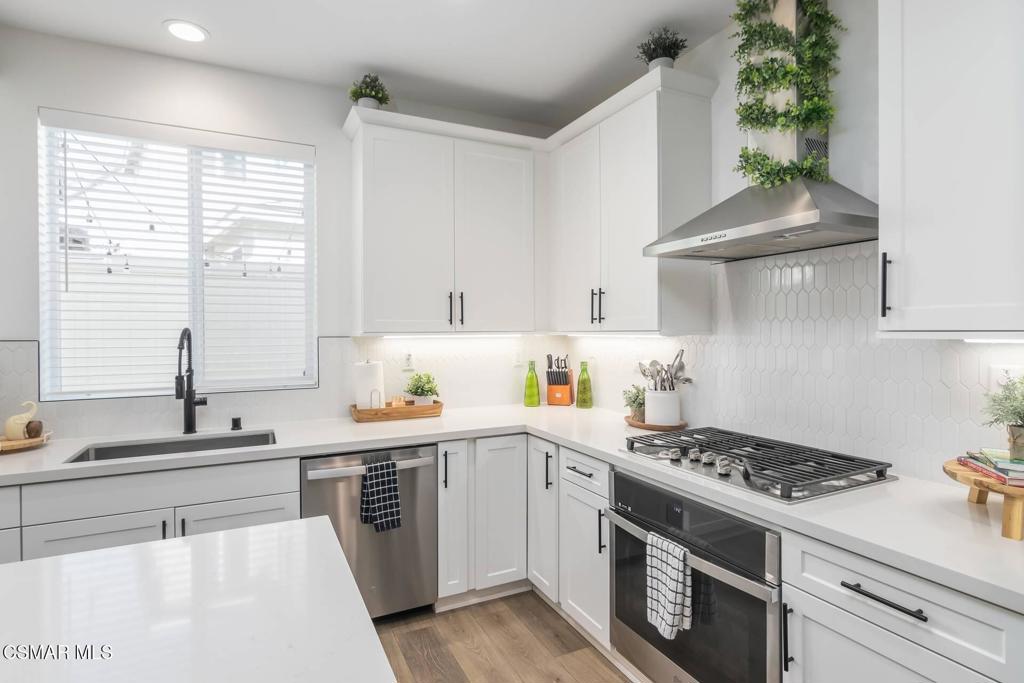 1855 Malalenca Road Santa Paula, CA 93060 - Photo 8 of 39 a kitchen with a stove a sink and a window