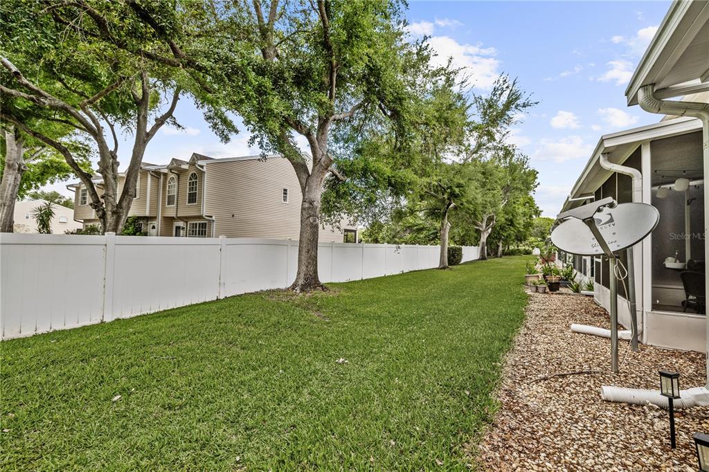 8520 Sandy Beach Street Tampa, FL 33634 - Photo 11 of 25 a front view of a house with garden