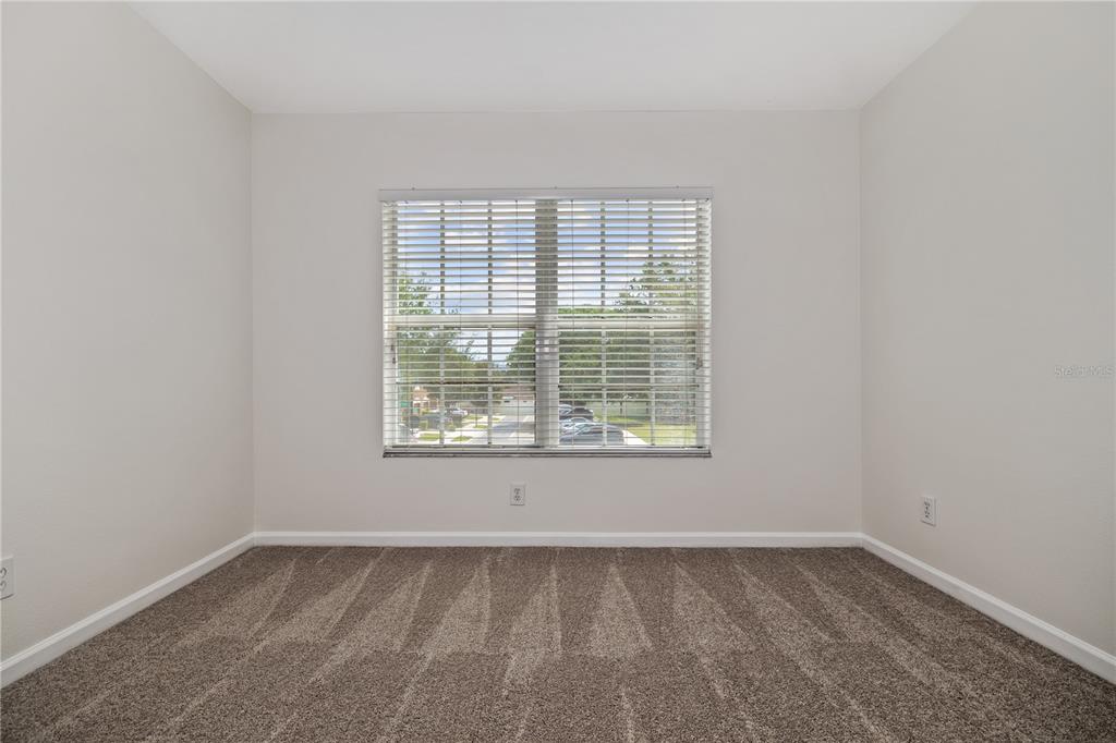 8520 Sandy Beach Street Tampa, FL 33634 - Photo 14 of 25 an empty room with a window
