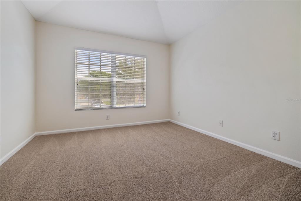 8520 Sandy Beach Street Tampa, FL 33634 - Photo 15 of 25 an empty room with a window