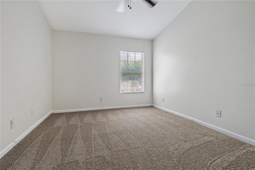 8520 Sandy Beach Street Tampa, FL 33634 - Photo 16 of 25 a view of an empty room with a window