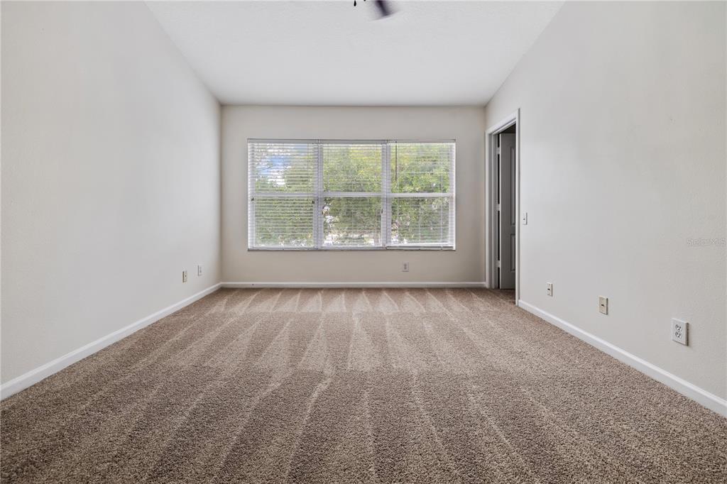 8520 Sandy Beach Street Tampa, FL 33634 - Photo 22 of 25 an empty room with a window