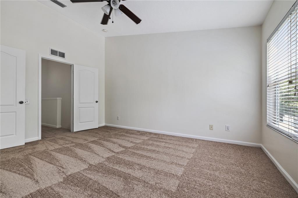 8520 Sandy Beach Street Tampa, FL 33634 - Photo 24 of 25 wooden floor in an empty room with a window