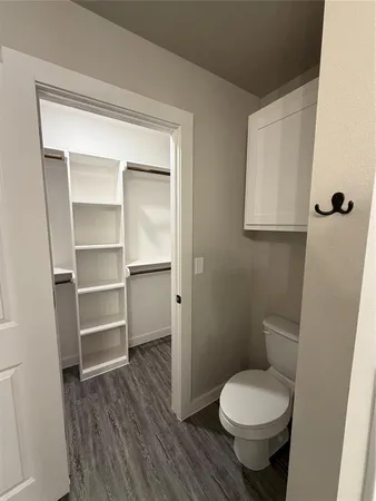 a bathroom with a toilet and a sink