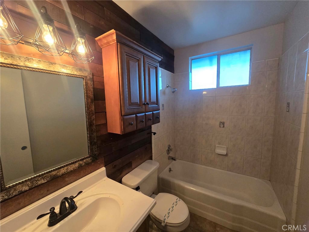 607 Sixth Street Norco, CA 92860 - Photo 16 of 17 a bathroom with a sink a toilet and shower